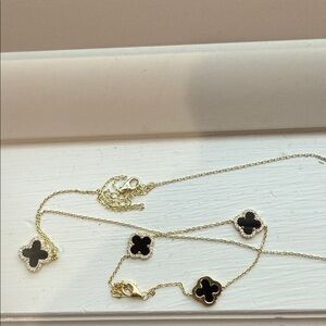 Elegant Gold and Black Clover Necklace